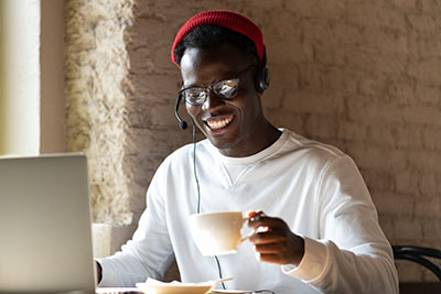 Man -w_ Headphones, glasses, mug, smiling